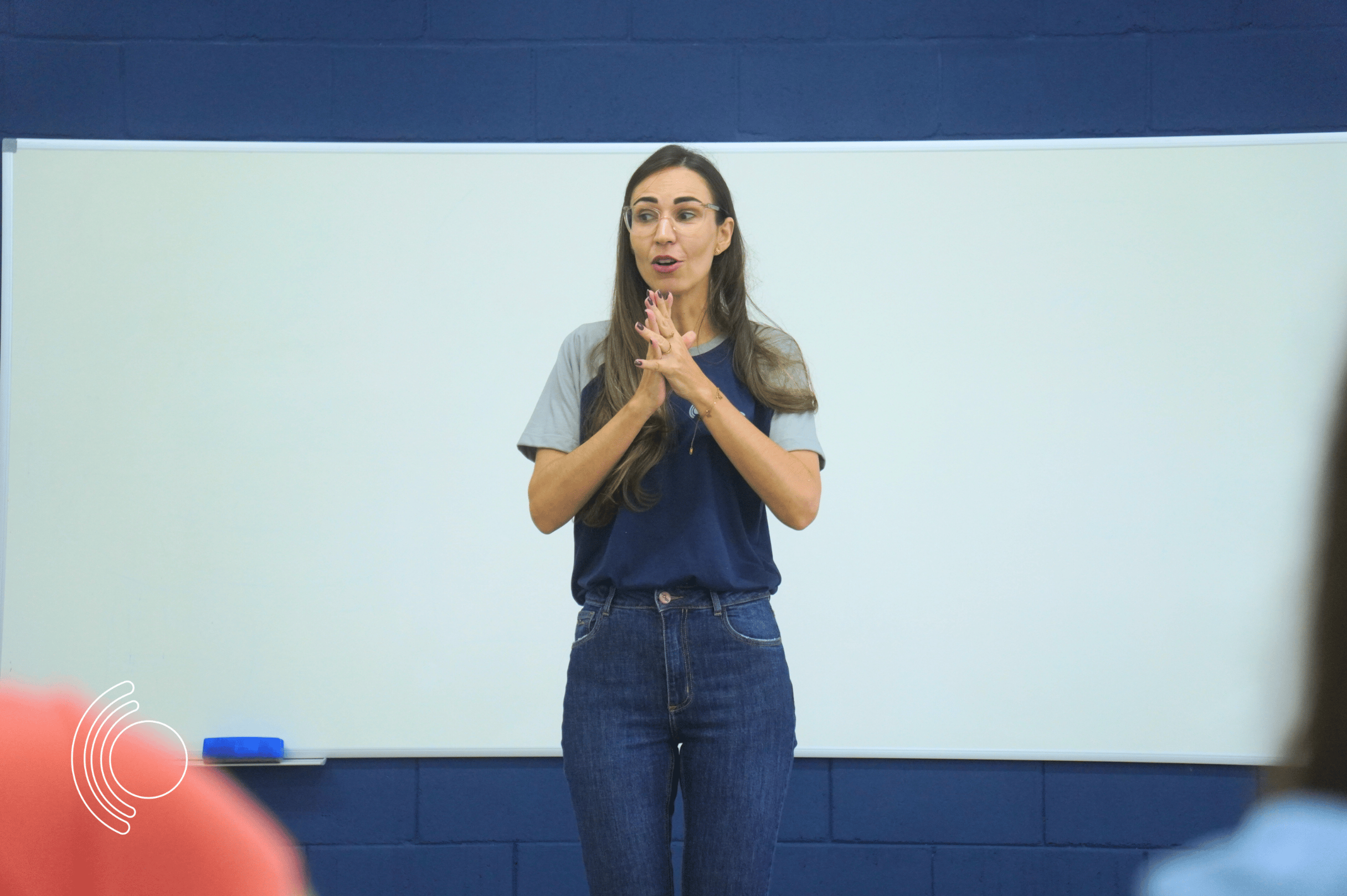 Photo of a study hall with wooden tables and chairs.